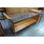 A G-Plan teak and glass topped tulip coffee table