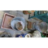 A Victorian saltglazed sink, a reconstituted stone sink, a pair of grates, a galvanised bucket and