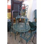 A painted green cast alloy garden table and four chairs