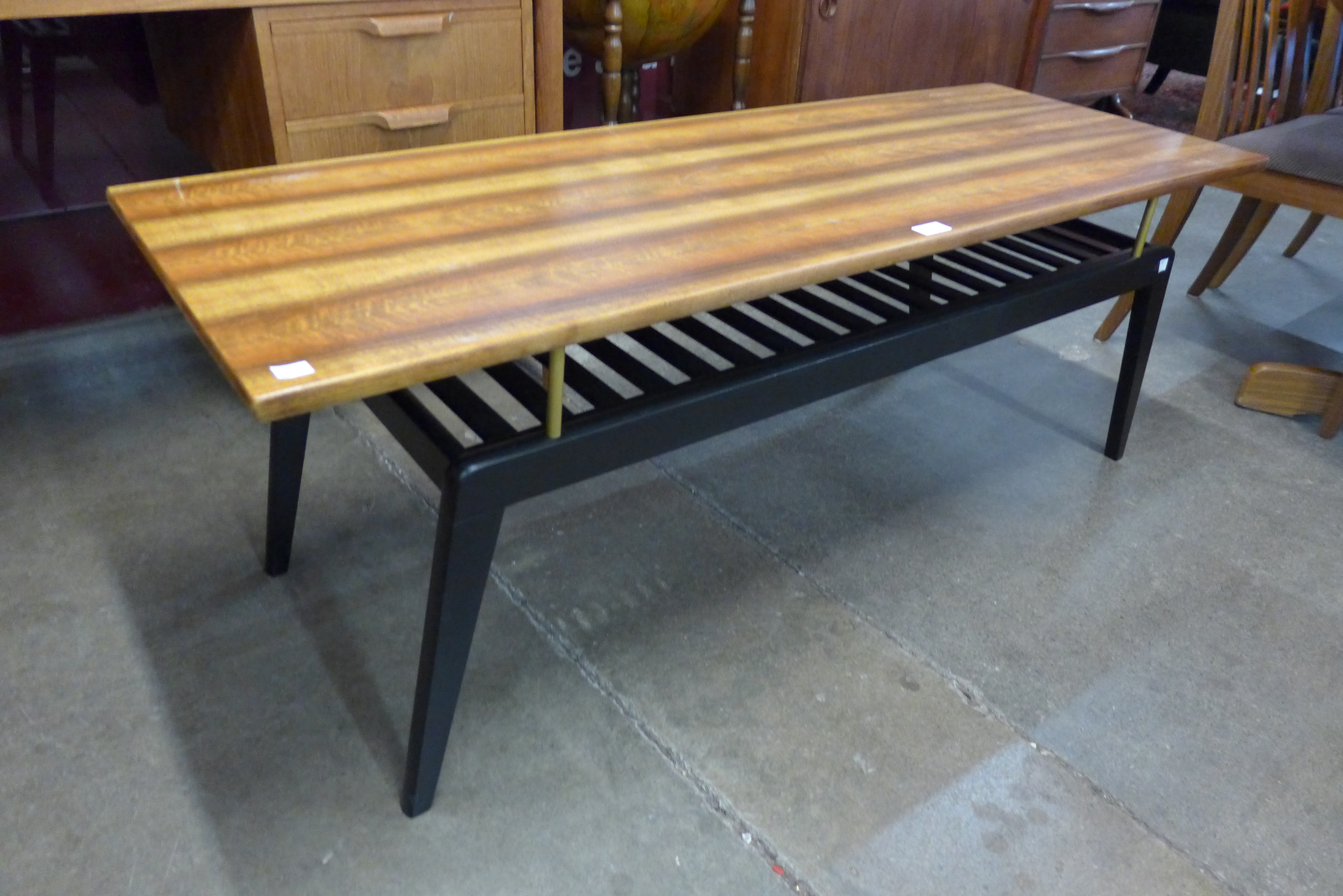 A tola wood and black coffee table