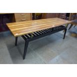 A tola wood and black coffee table