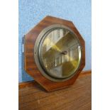 An early 20th Century inlaid mahogany octagonal aneroid barometer, the brass dial signed James