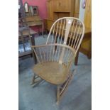 An Ercol Blonde elm and beech Chairmaker's rocking chair