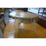 An Ercol Blonde elm and beech drop-leaf 308 model occasional table