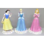 Three Royal Doulton figures; Snow White, Sleeping Beauty and Cinderella, boxed