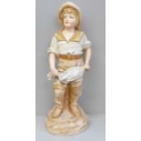 A 19th Century French porcelain figure of a fisher boy, 36cm