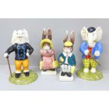 Two Royal Doulton figures of Rupert characters and two other figures