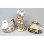 Two Royal Crown Derby paperweights with silver stoppers, cat and frog, seconds and a Royal Crown