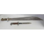 A short sword or machete with carved horn handle and a bayonet lacking scabbard