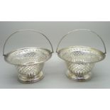 A pair of pierced silver bon-bon dishes with handles, Birmingham 1903, 210g