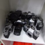 A collection of seven cameras, all Praktica, two with lenses