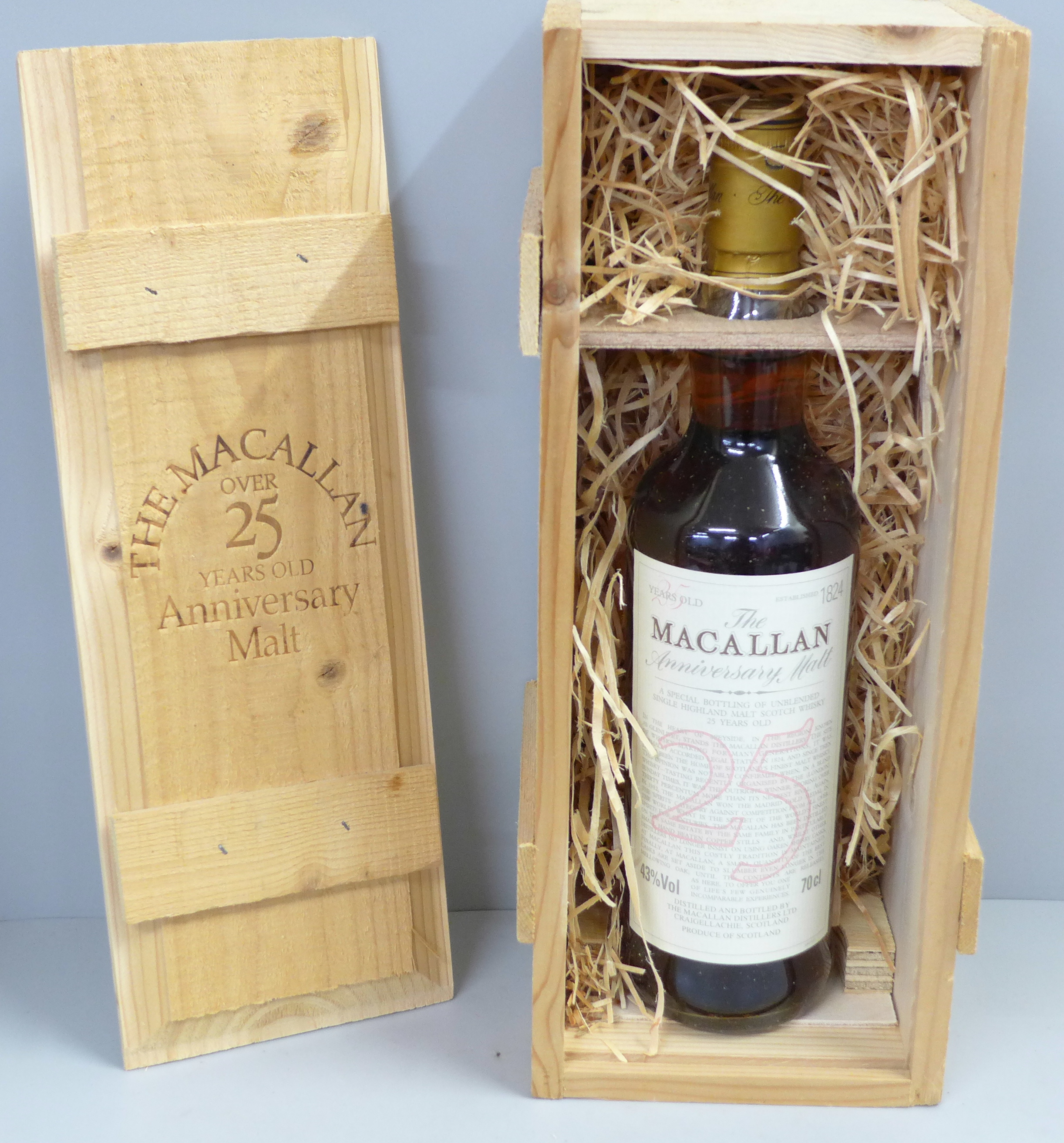 A bottle of The Macallan over 25 years Old Anniversary Malt Whisky, boxed