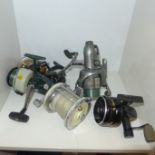 Five fishing reels including Abu Garcia, Garcia Mitchell 624 and Penn 4500SS