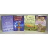 Four first edition novels by Bernard Cornwell, two signed