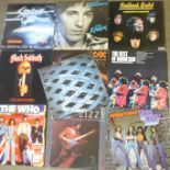 A collection of LP records; The Rolling Stones, AC/DC, Black Sabbath, Thin Lizzy, The Who, Mountain,