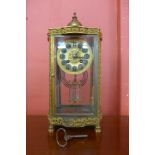 A 19th Century French ormolu and glass four sided table clock, with mercury pendulum