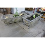 A pair of concrete rectangular garden planters