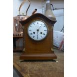 An early 20th Century French Japy Freres inlaid mahogany mantle clock