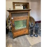 A Victorian oak wall mounted meat safe and a pair of horse jockey figure cast iron door stops