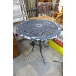 A circular painted alloy garden table