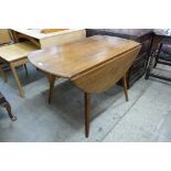 An Ercol elm and beech Windsor drop-leaf table