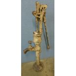 A large Victorian style cast iron water pump