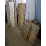 Assorted Victorian pine window shutters and cupboard doors