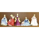 Five Royal Doulton figures; Autumn Breezes, Hilary, Loretta, The Hostess of Williamsburg, a/f, and
