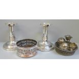 A pair of silver plated candlesticks, a Mappin & Webb egg cruet and wine coaster