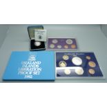 A silver proof £1 coin, a 1977 Royal Australia mint proof coin set and a 1982 Falkland Islands