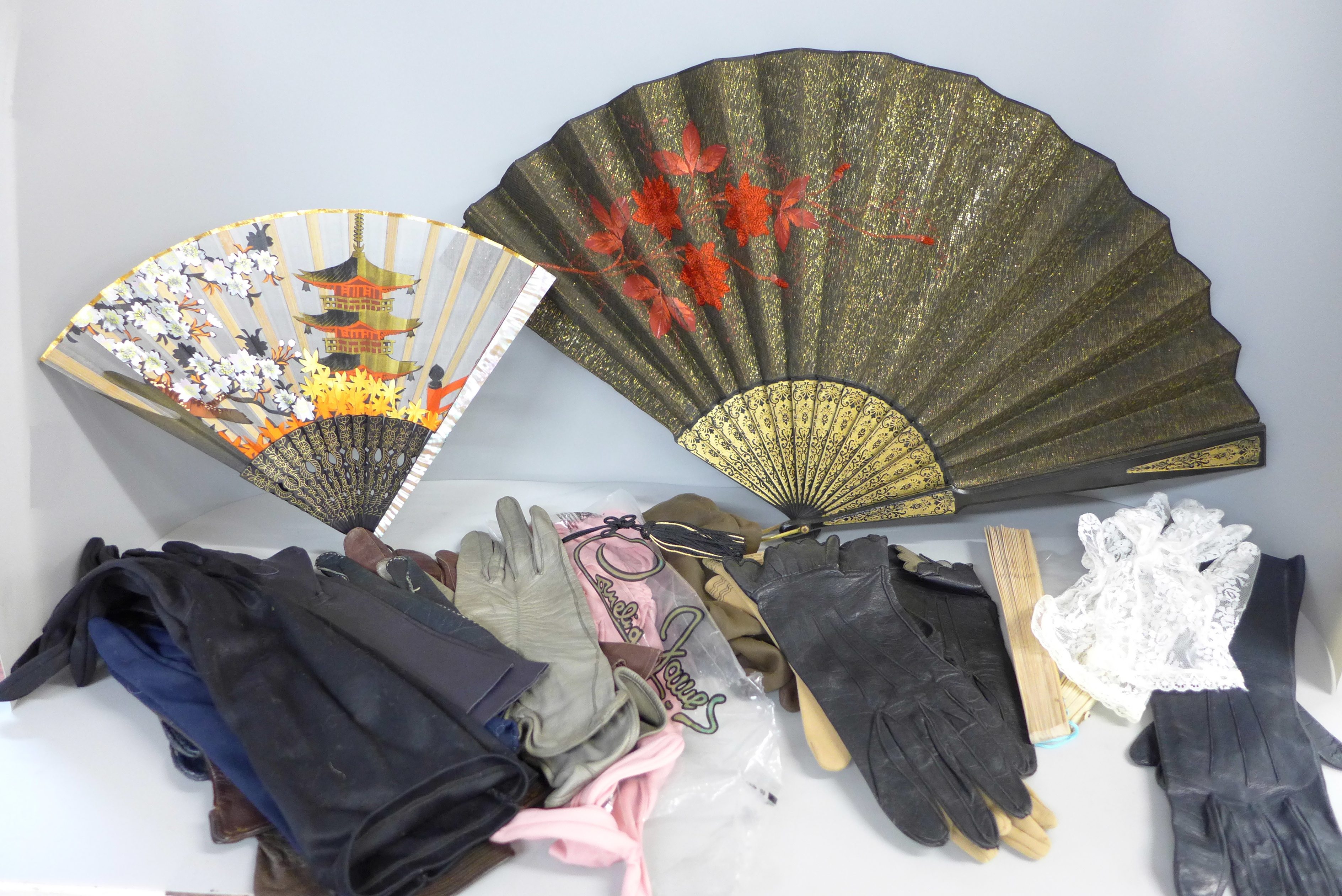 Assorted lady's leather and other gloves and fans