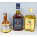 Three bottles; Jim Beam Double Oak Twice Barrelled Bourbon whisky, a half bottle of White Horse