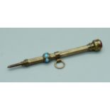 A Victorian yellow metal propelling pencil set with turquoise, outer case tests as gold, 2.8g