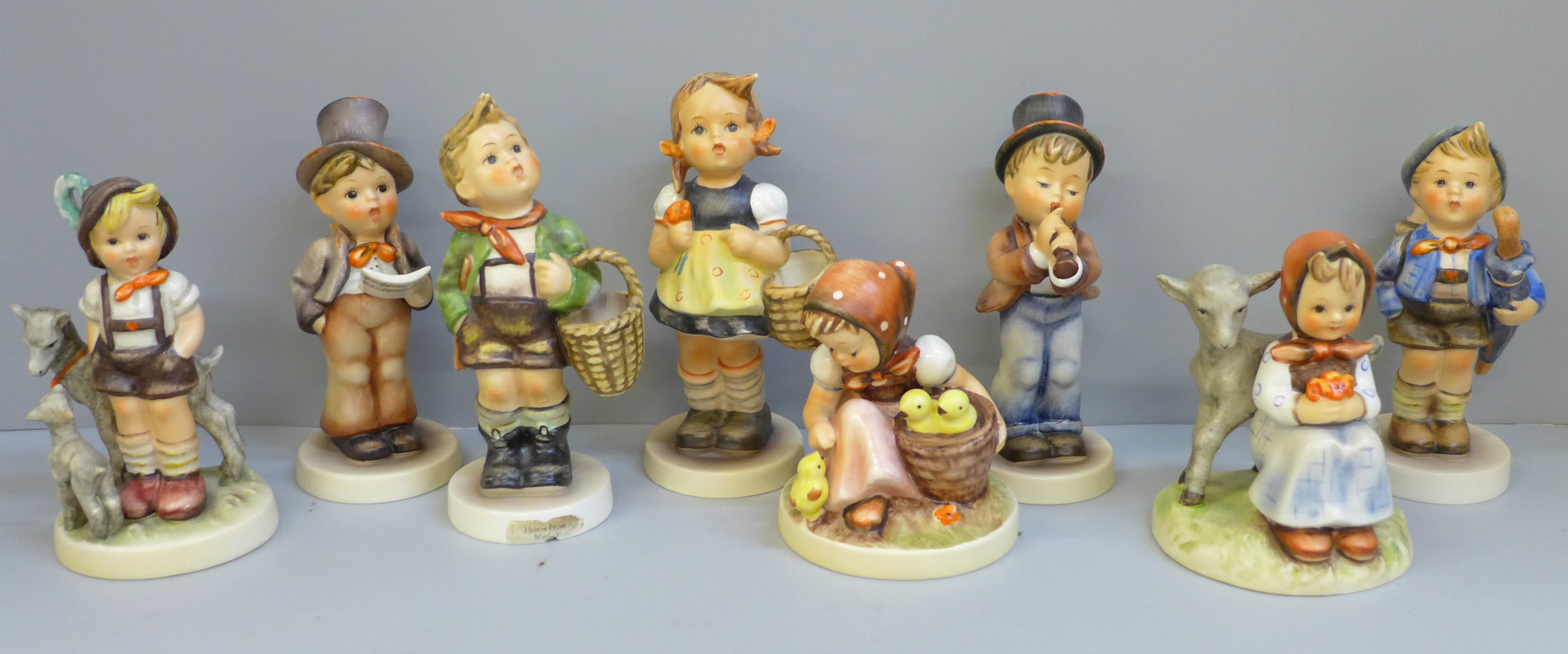 Eight Hummel/Goebel figures, two a/f, small chip to umbrella and to base