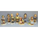 Eight Hummel/Goebel figures, two a/f, small chip to umbrella and to base