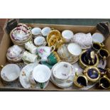A collection of continental French and German cups and saucers, one on a tray, a few in a set