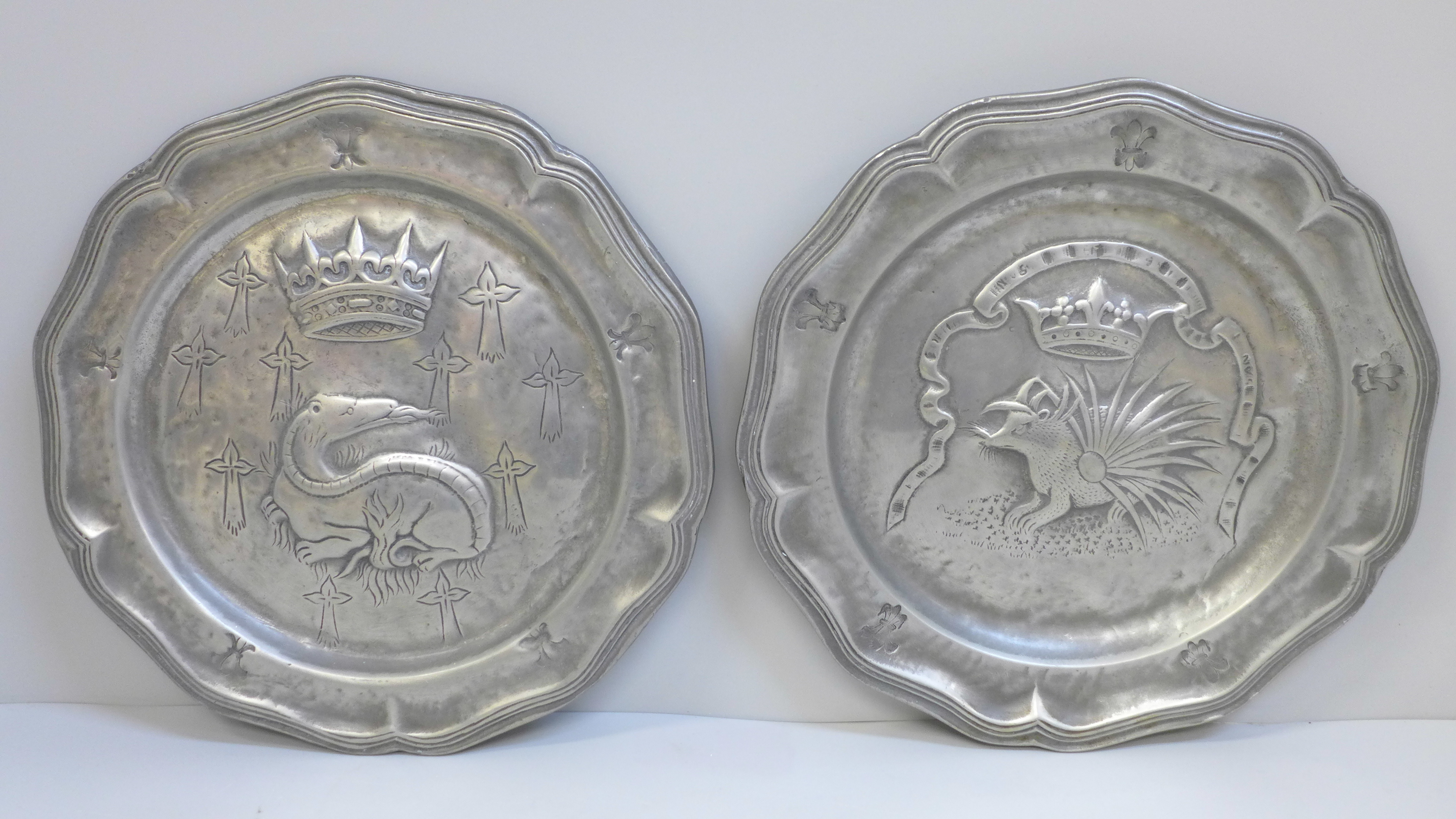 Two French early pewter plates, contoured edges, decorated with crown over a porcupine and a crown