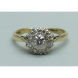 An 18ct gold and diamond cluster ring, 3g, O