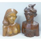 Two wooden carved figures of a Bali man and woman