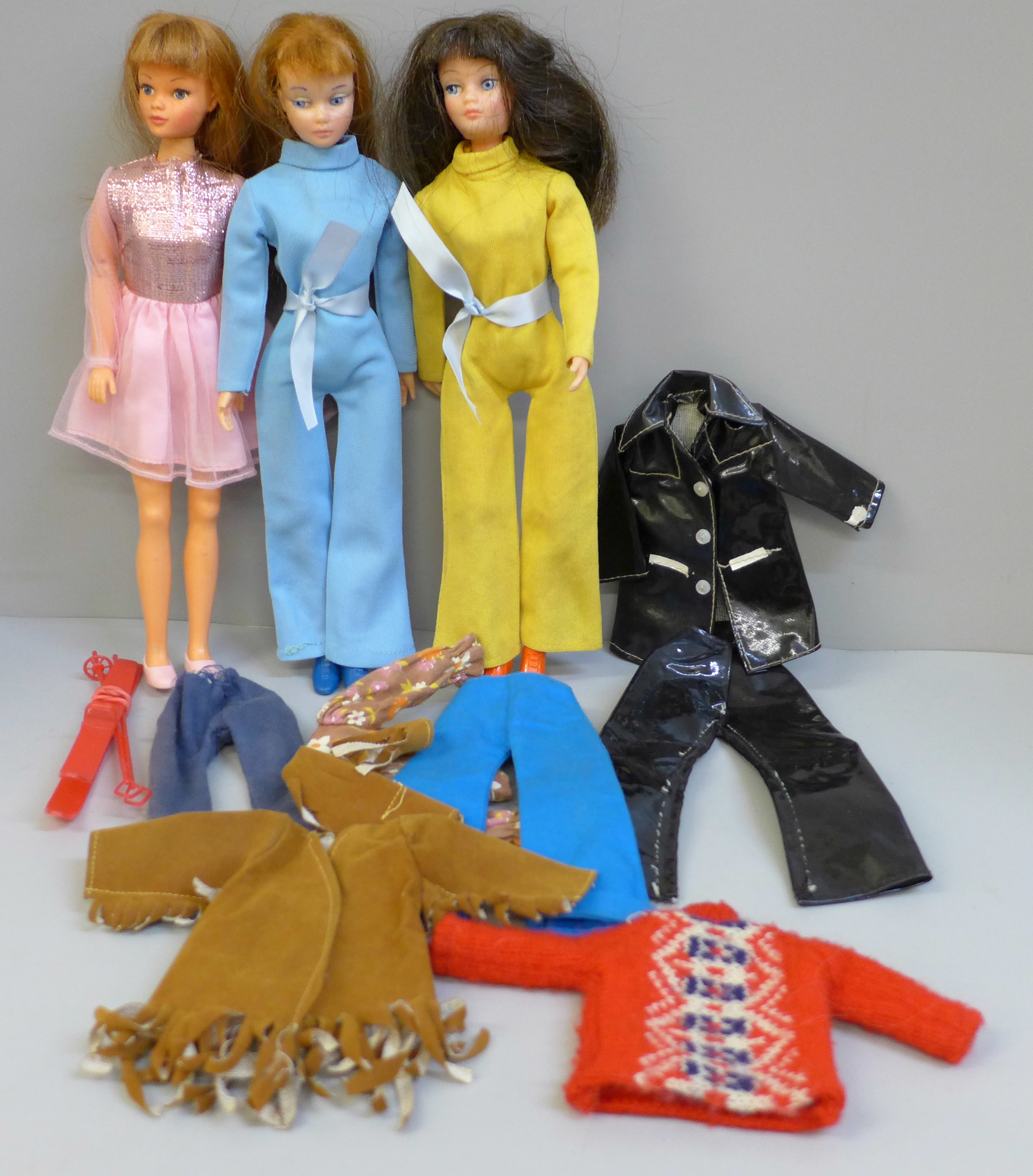 Three 1970's dolls and clothes; two Uneeda Doll Co. and one other