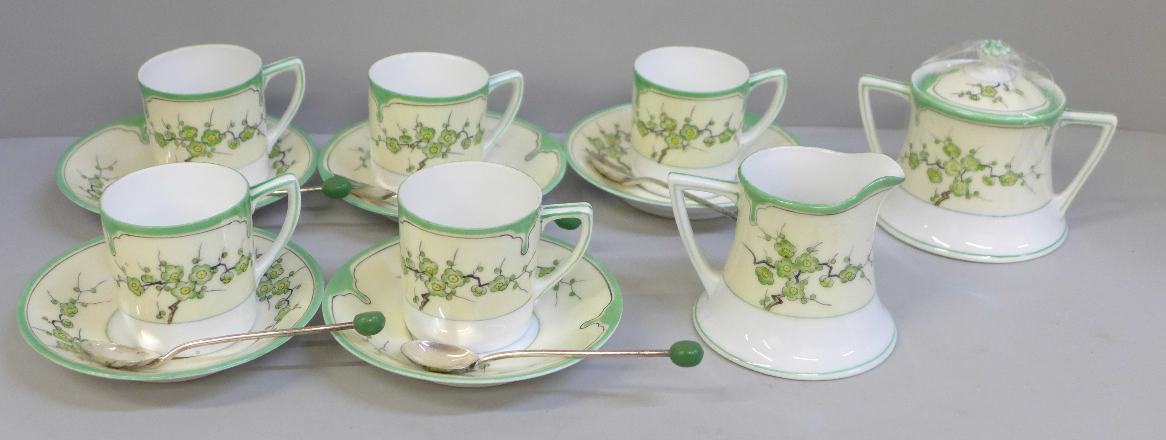 A Noritake five setting coffee set and coffee spoons