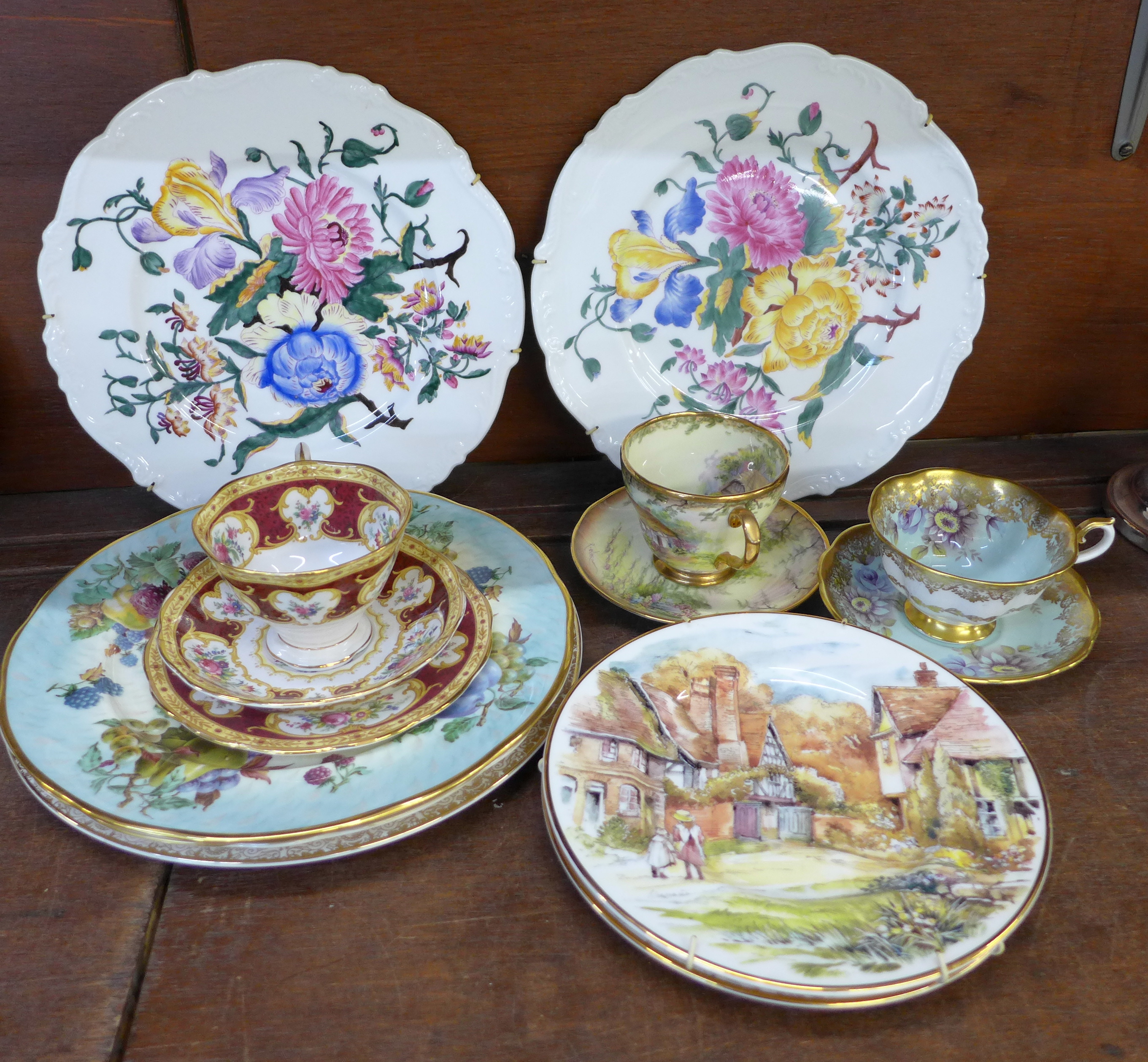 A Royal Albert tea cup and saucer, second, a Royal Albert Lady Hamilton trio, a Lime House Studio