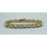 A silver gilt, simulated diamond line bracelet