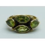 A silver gilt and peridot ring, N