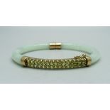 A 9ct gold and jade bangle set with green stones