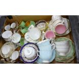 A large collection of English porcelain cups and saucers including Minton, Davenport, Royal Doulton,