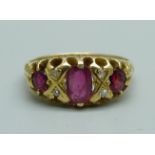 An 18ct gold, ruby and diamond ring, Birmingham 1906, 3.6g, L