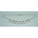 An Arts and Crafts moonstone necklet, tests as silver, 43.5cm