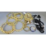 Ten gold tone collars set with faux pearls and other gold tone jewellery including Cabouchon