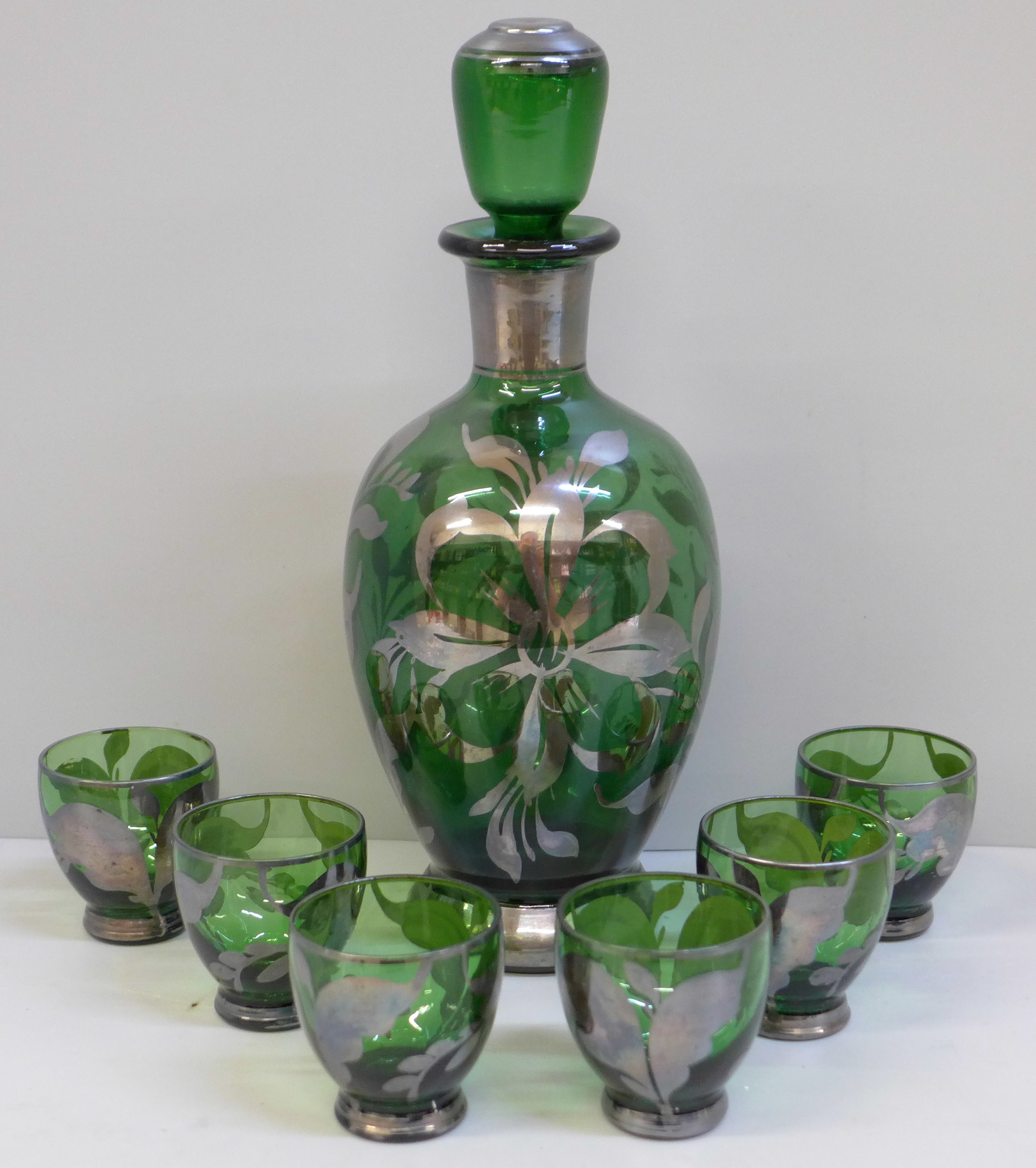 A green glass liqueur set; decanter with six glasses